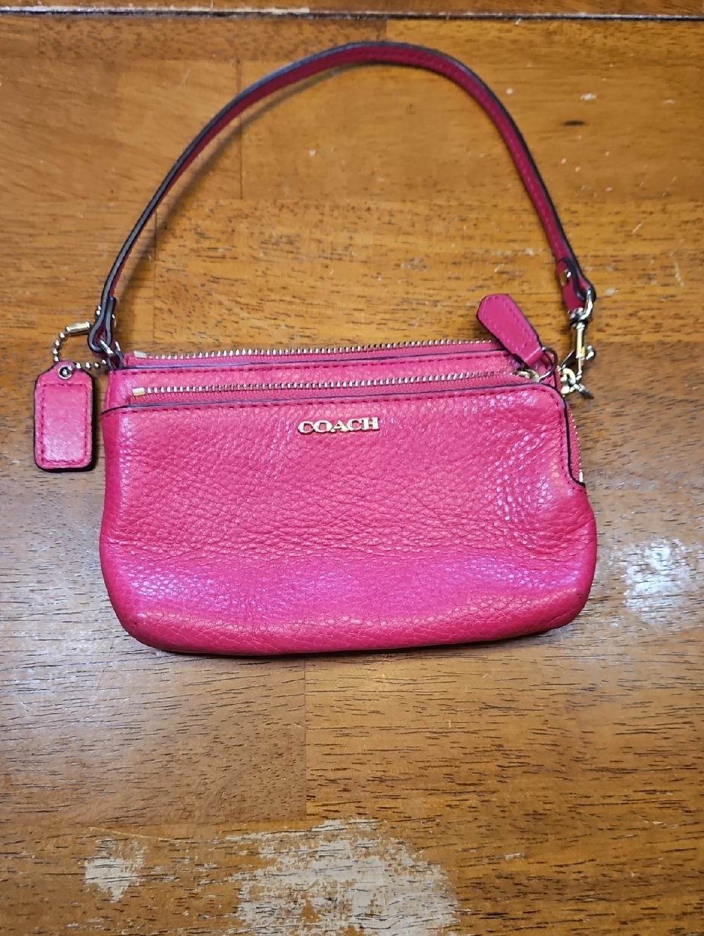 COACH Bright Pink Pebbled Leather Wristlet with Gold Hardware